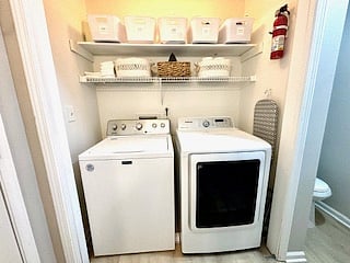 A practical laundry room is situated on the main level, providing easy access and eliminating the need for stairs. Equipped with efficient appliances and ample storage, this laundry room is a convenient addition to the home.