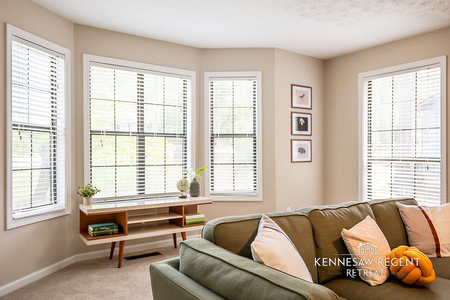 This newly remodeled space is a masterclass in mid-century modern design. Clean lines, natural light, and carefully selected pieces come together to form an elegant and functional living area.