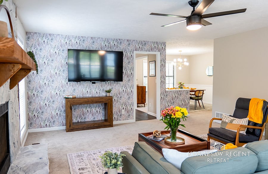 This newly remodeled space is a masterclass in mid-century modern design. Clean lines, natural light, and carefully selected pieces come together to form an elegant and functional living area.