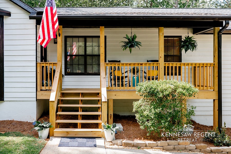 Relax on the covered porch with views of stunning landscaping, colorful flowers, and a peaceful cul-de-sac setting.