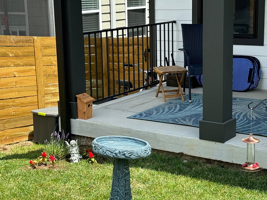 The porch is being renovated to a three season room and overlooks our backyard garden bird feeders and flowers.
