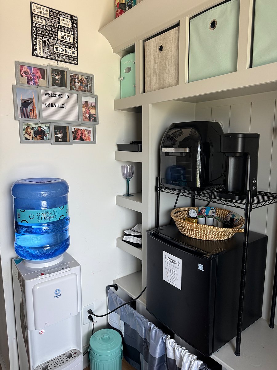 Mini Kitchenette boasts a small air fryer/convection oven, microwave, "Keurig" style coffee machine, toaster, and all the necessities to enjoy simple meals.