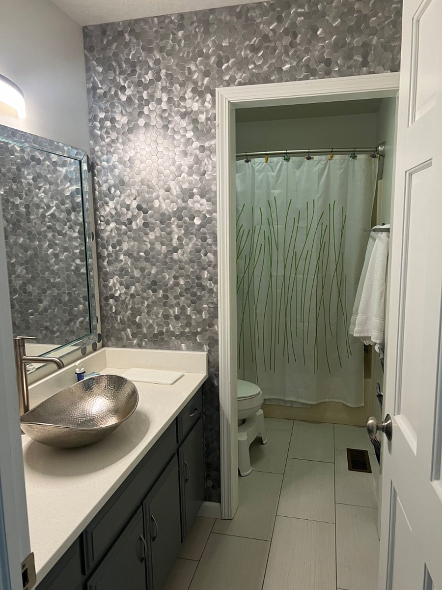 Your bathroom with tub/shower combo.