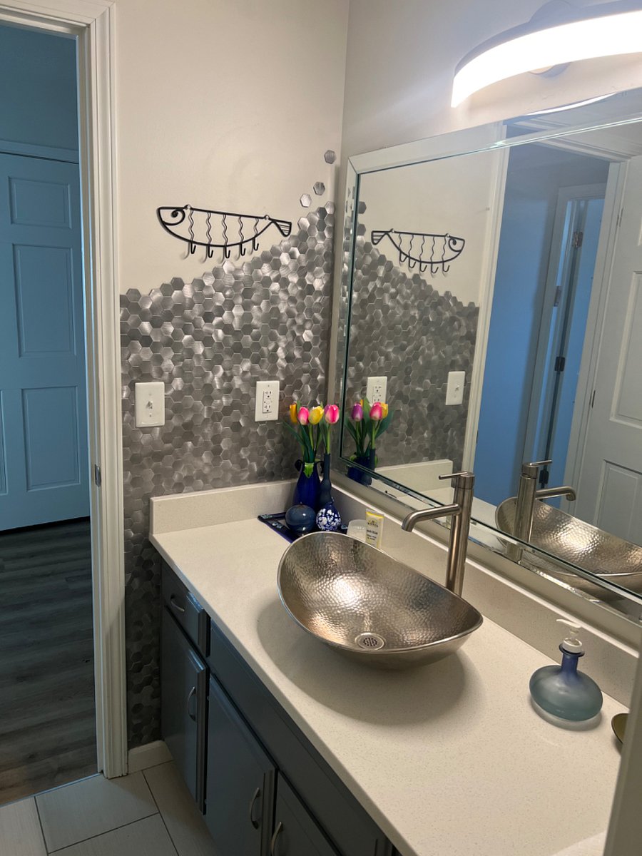 Linen closet and plenty of room in vanity.