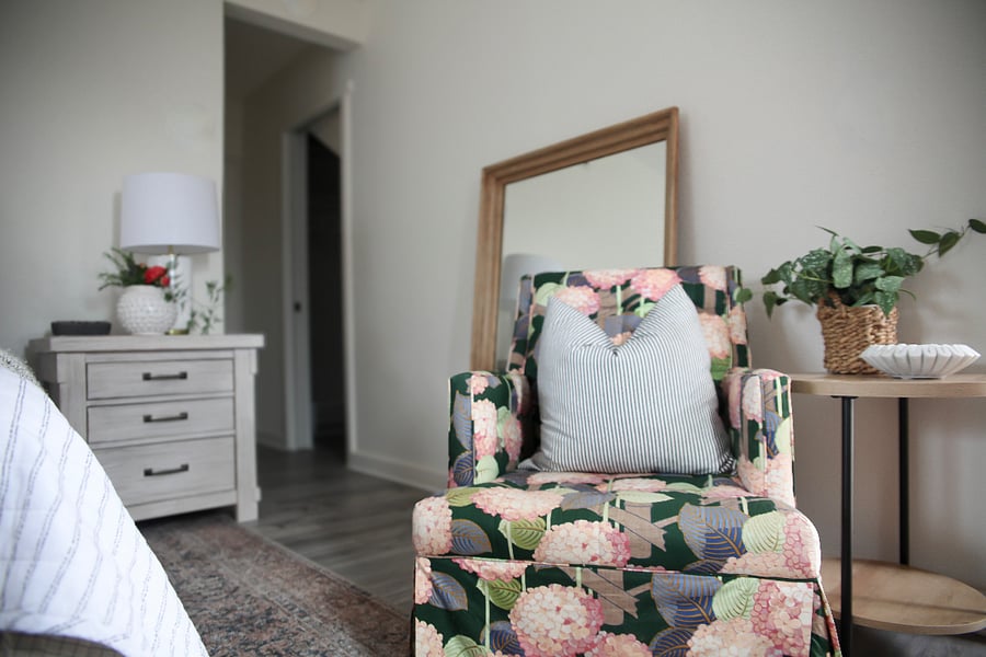 The nightstand has built in electrical and USB ports. The doorway to the right of the nightstand leads to the ample closet.
