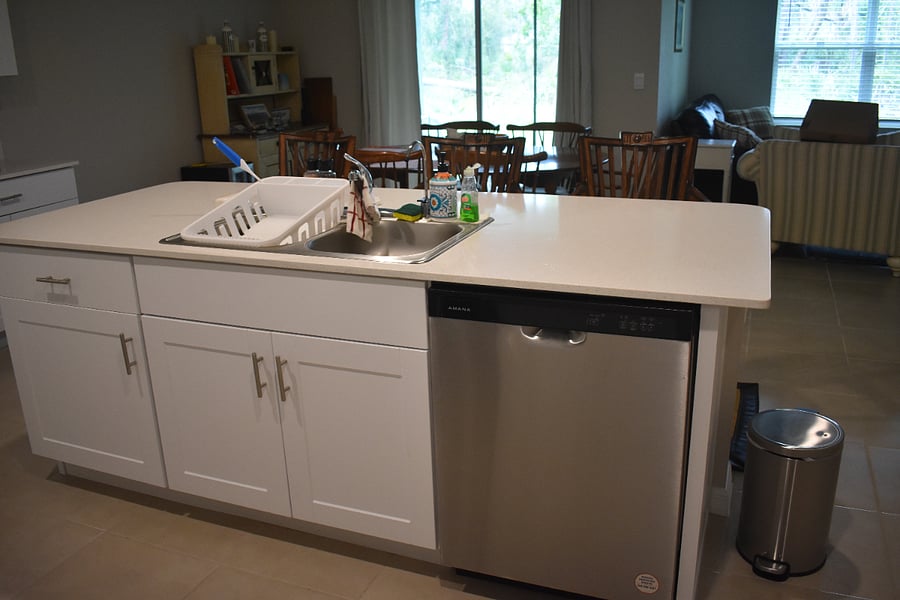 Dishwasher & sink across from oven section