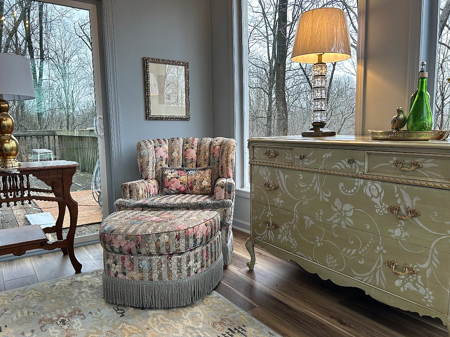 sunroom off of primary bedroom opening to the rear deck with gorgeous wooded view