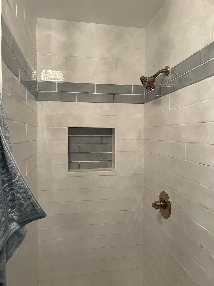 beautifully designed 2nd bathroom with shower and adjacent laundry room with washer and dryer