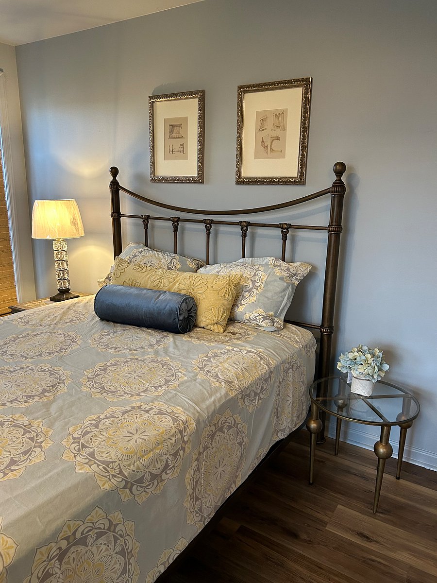 extremely comfortable queen bed located in primary bedroom
