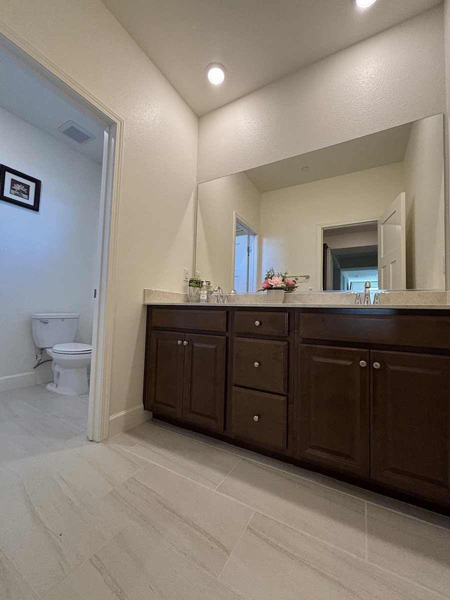 Second bathroom with double sinks.