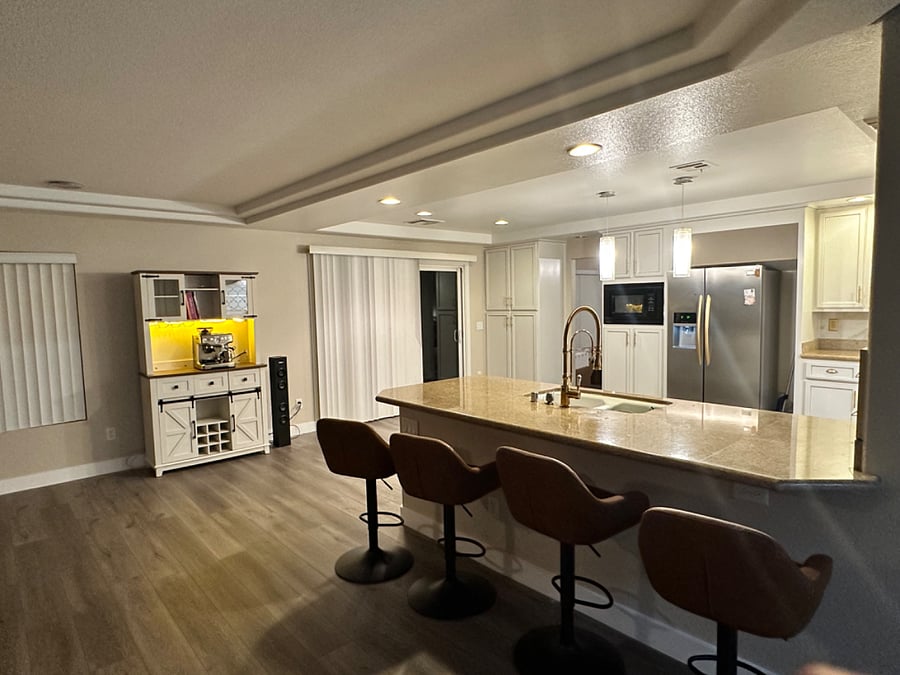 Kitchen area with seating for 4 countertop, And coffee bar with espresso maker,