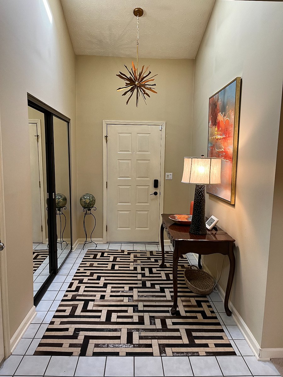 Foyer with mirrored closet