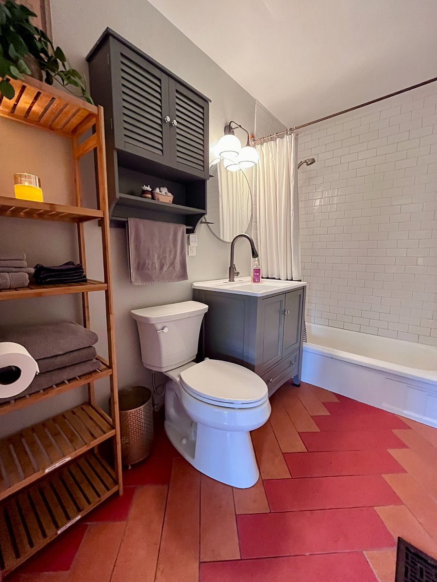 tiled bath, ADA toilet, 13" tub, handheld hose, utility sink with pull down faucet 