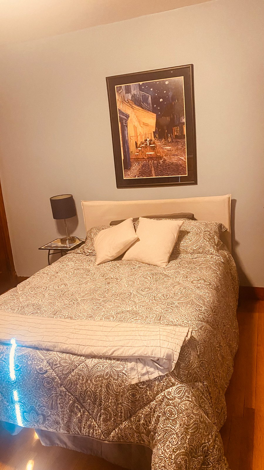 Blue bedroom with full sized smart tv