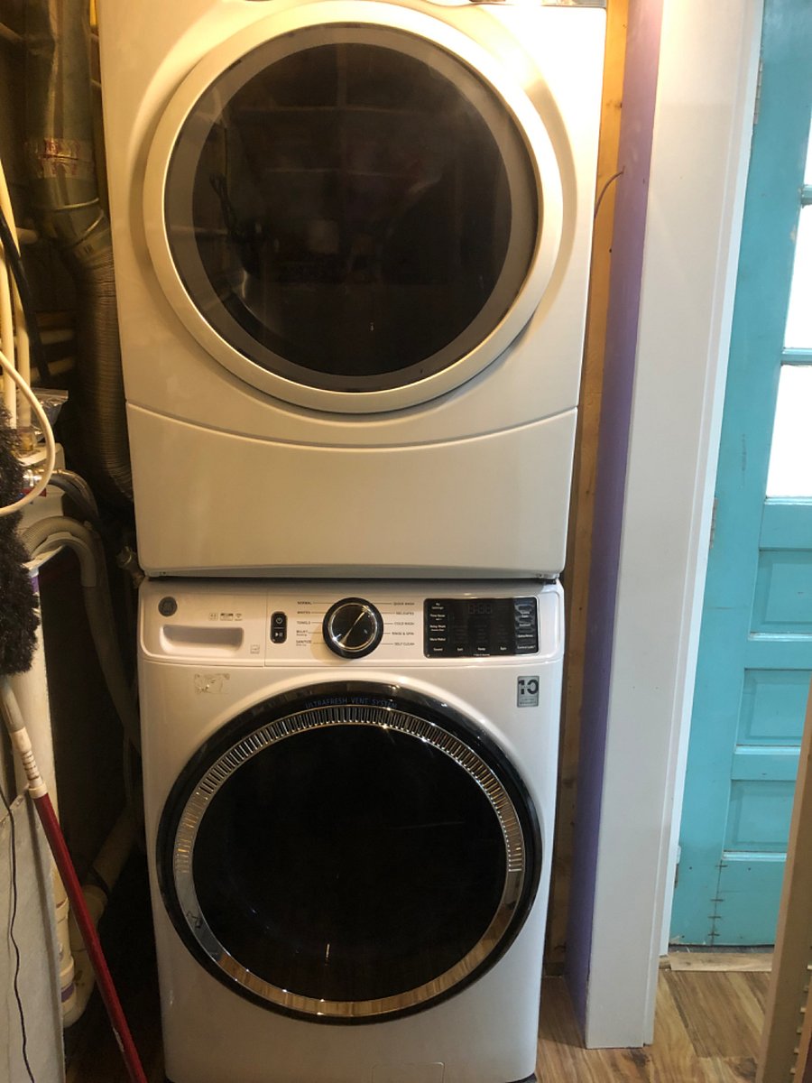 New washer and dryer tucked neatly away.