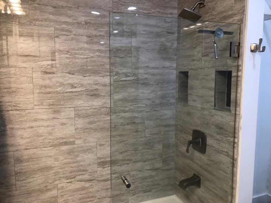 Gorgeous glass door tub and shower.