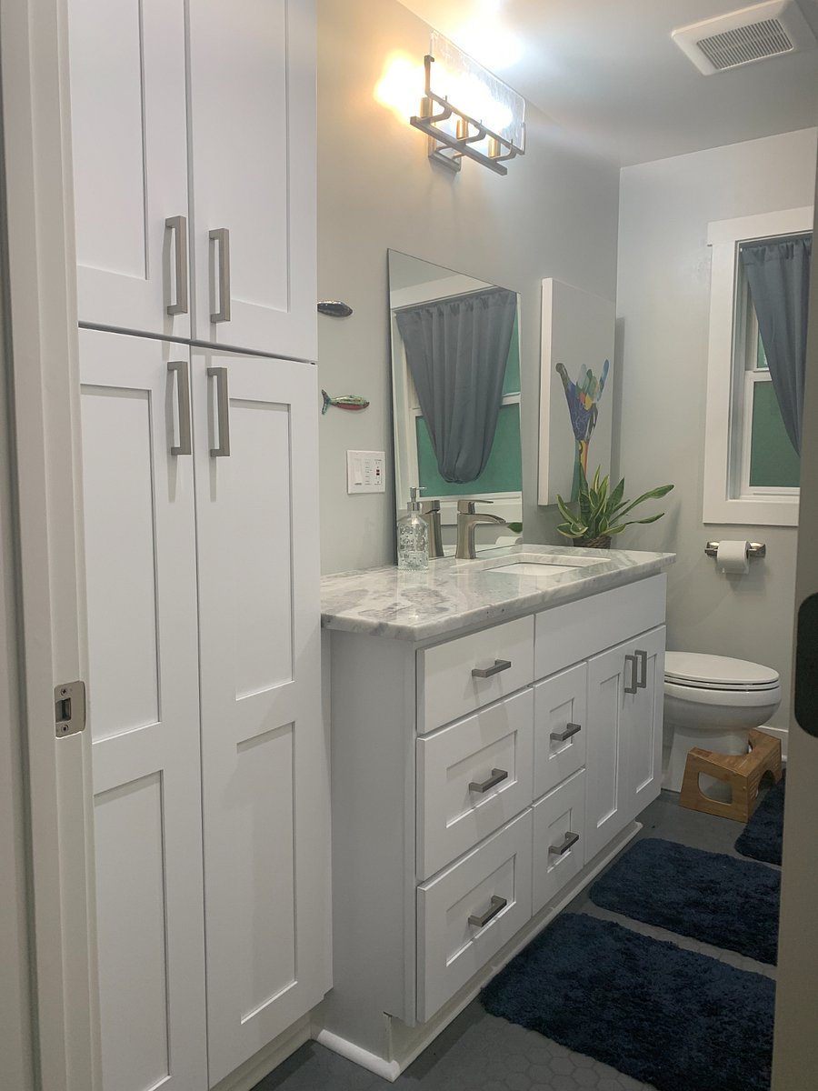 Main bathroom has great storage.