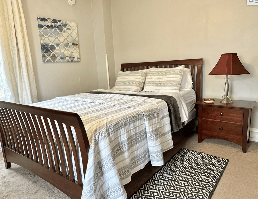 Queen size bed - 12 inch green tea mattress. We get great complements on this mattress. Black out curtains. Ear plugs in drawer if necessary