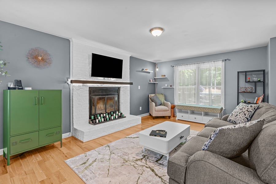 Comfortable living space with a smart TV and storage.
