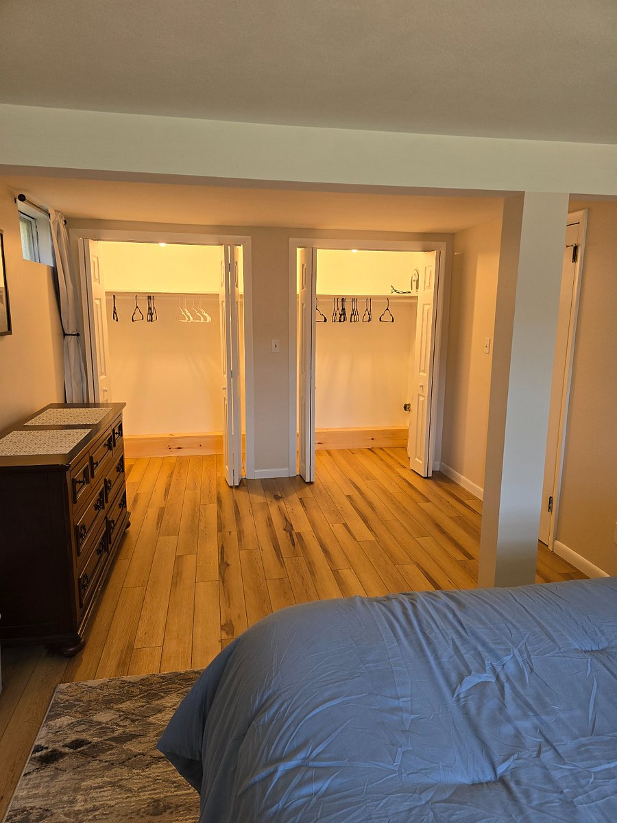 two large closets with lighting