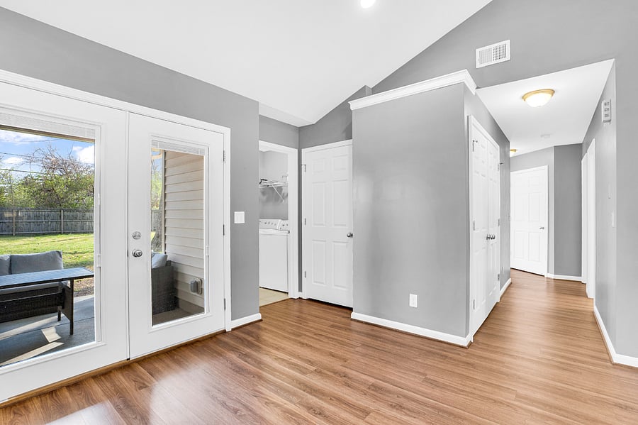 Outdoor patio / laundry room / hallway to bedrooms