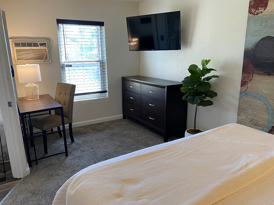 bedroom with designated work space