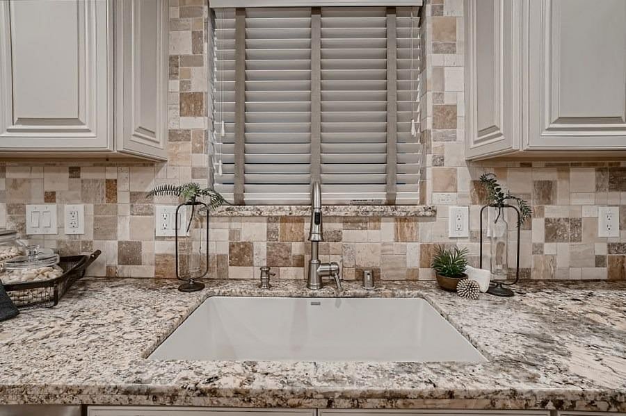 Marble countertops, kitchen island with bar-height seating