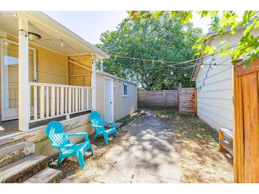 back patio area and access to garage storage area. Garage storage cannot be used for cars. 