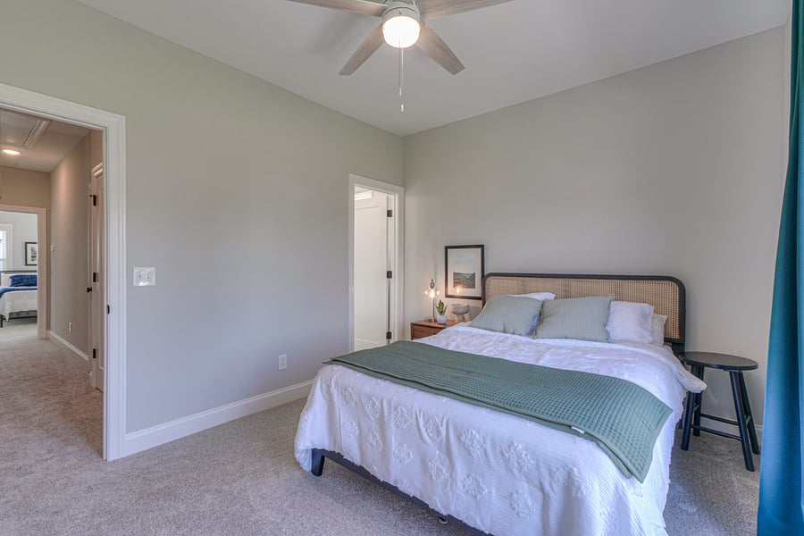 Bedroom 2 with a queen bed, private bath and walk out deck