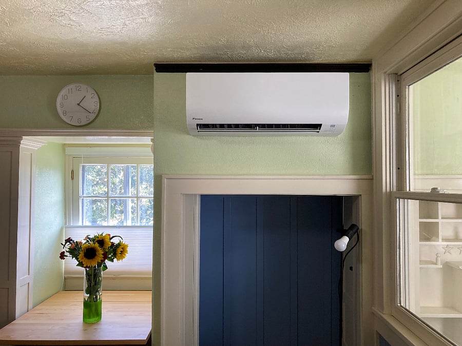 Ductless heat pump, both heat and air conditioning.Remote thermostat controlled by traveler