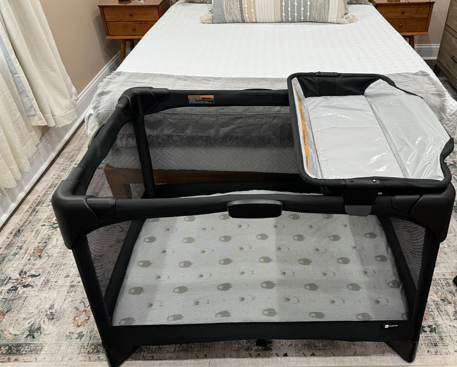 Playard with removable bassinet and changing table