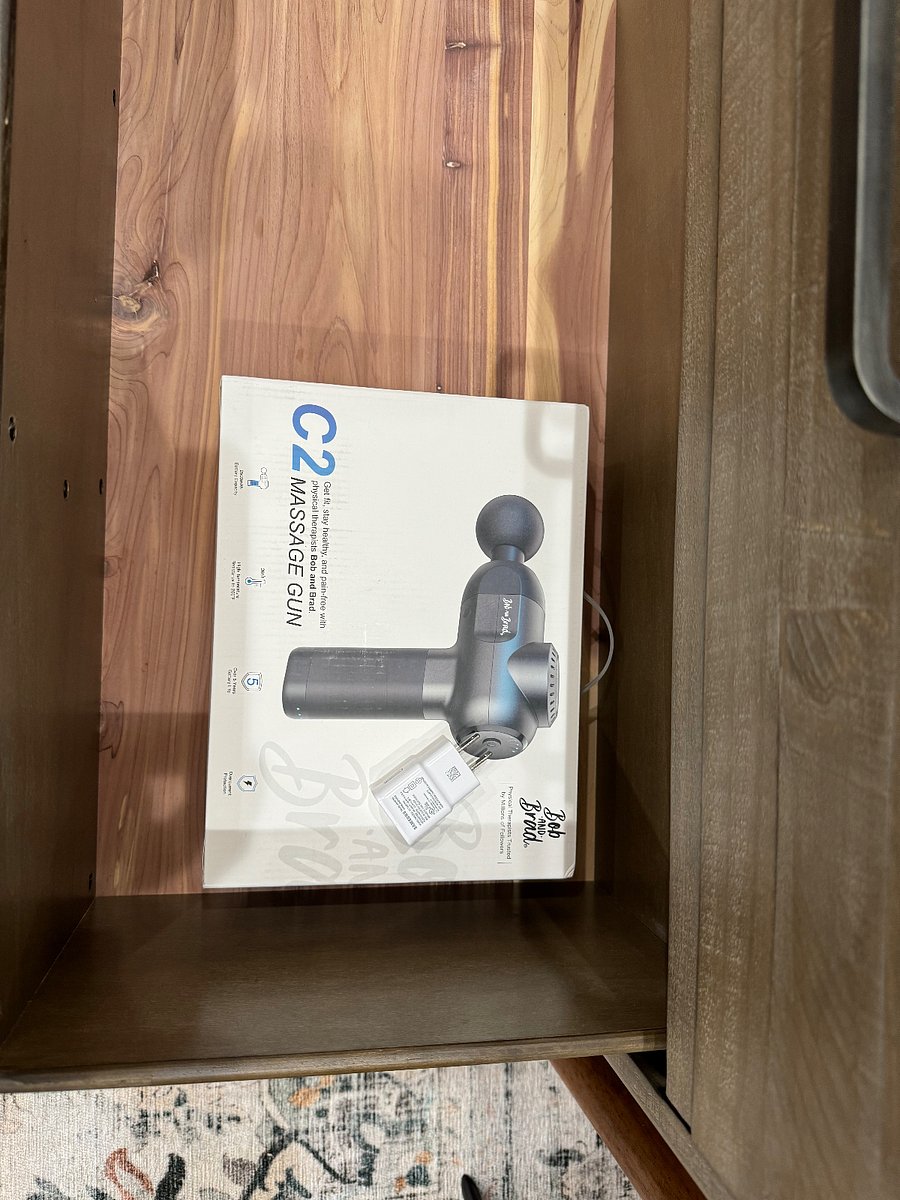 Massage gun fully charged, ready to use found in bedroom 1
