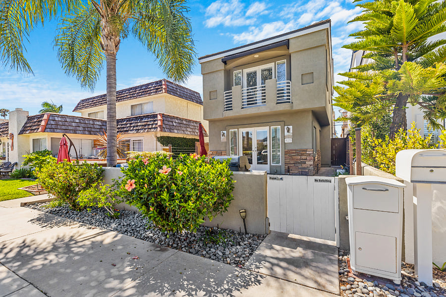 Street view of house. Large patio.