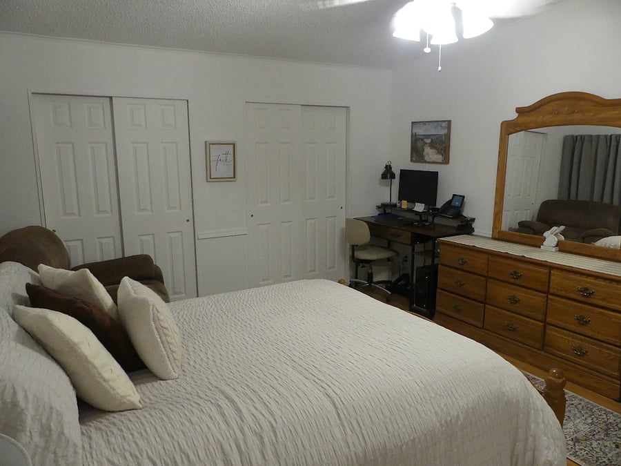 Master bedroom with view of closets