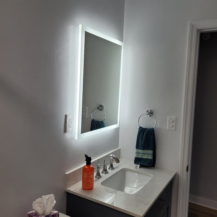 Lighted mirror in the bathroom