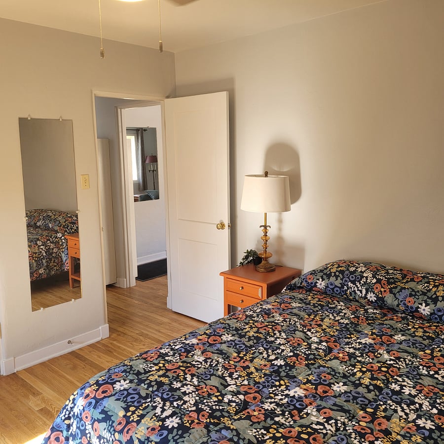 Bedroom two has warm orange accents