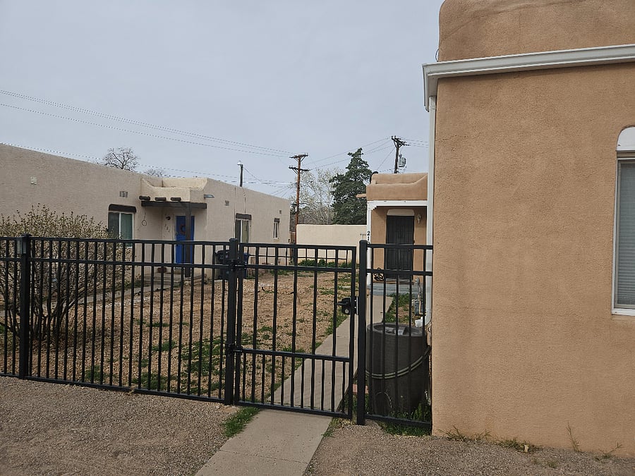 Secure and fenced common space outside your front door.