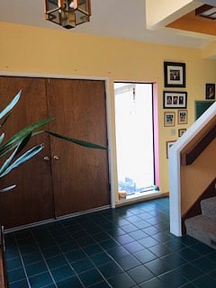 Entry way with stair case leading to your private room.