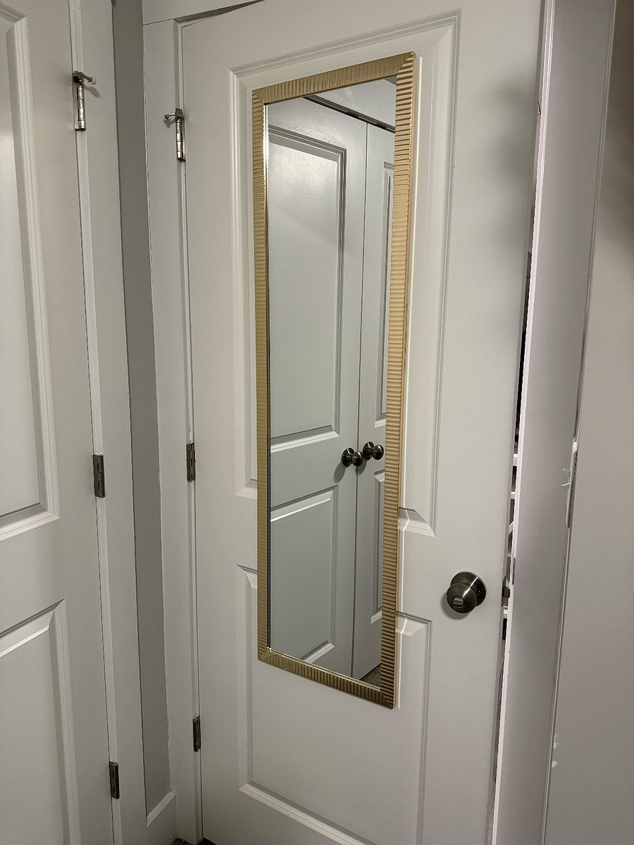 full body mirror behind bedroom door