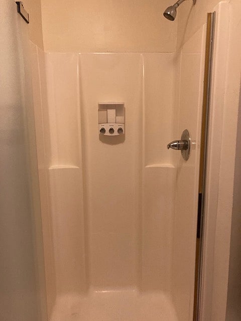 Each shower has soap, shampoo and conditioner dispensers