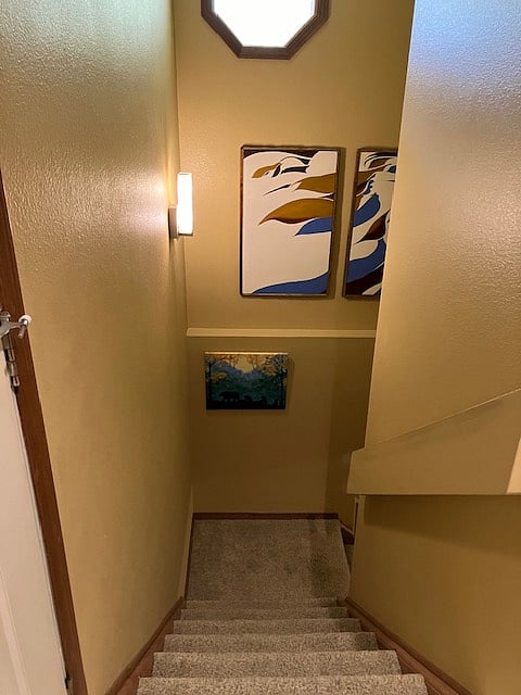 Stairs down to apartment/up to laundry room.