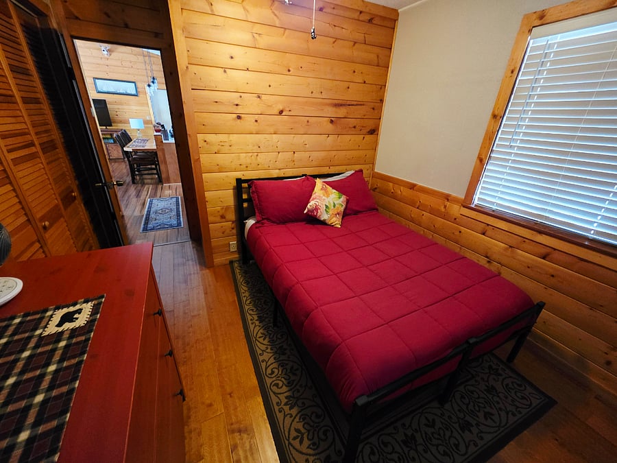 Relax in our cozy spare bedroom, where soft, comfortable bedding and charming cabin touches create a peaceful retreat. Wake up refreshed and ready for another day of mountain adventures. 