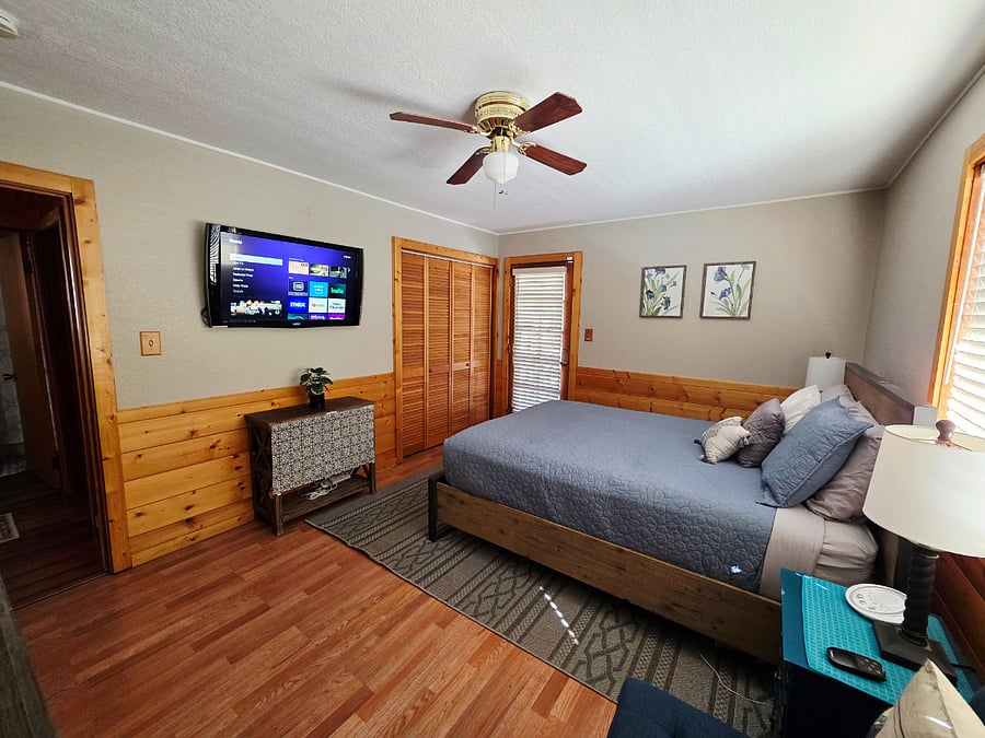 A different angle of the main bedroom highlights its clean, spacious, and well-appointed designroomier than many comparable cabins. Enjoy the perfect balance of comfort and openness, offering ultimate rest and relaxation without feeling cramped. 