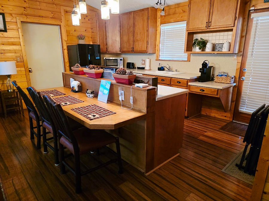 The spacious eat-in kitchen is the heart of the cabin! Clean, fully equipped, and ready for anythingfrom preparing a hearty mountain meal from scratch to quickly heating up a snack on the go. 
