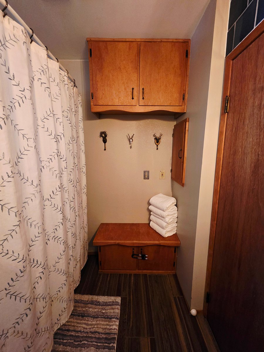 Another view of our clean, spacious, and functional bathroom. Hang your towels, store your essentials, and get ready for adventures around town, The Village, and Big Bear Lake feeling refreshed and ready to go. 