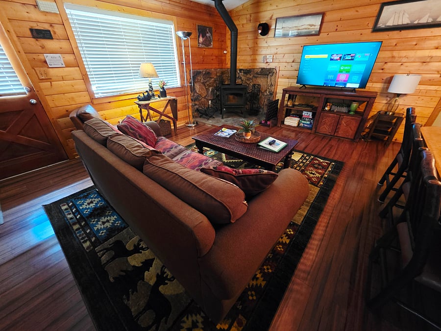 A fresh perspective of our cozy living room, offering plenty of space to relax and unwind. Picture yourself spending quality time here with loved onesand even your furry companioncreating lasting memories in comfort and style. 