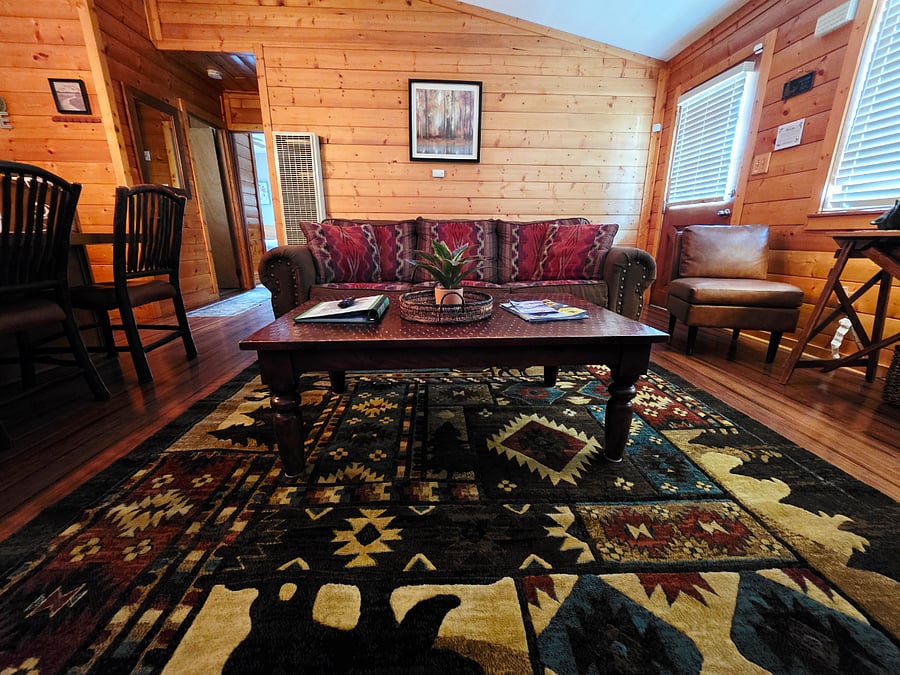Guests love the cozy sofa bed and the open-concept living room and kitchen layout! The seamless flow between spaces makes it ideal for groups, creating a bright and inviting atmosphere for relaxing, cooking, and making memories together. 