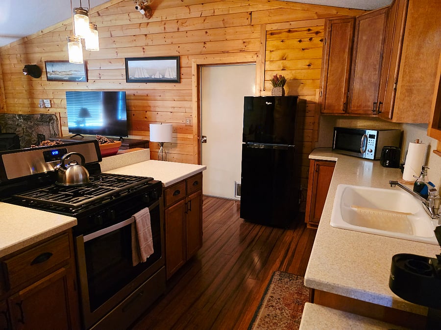 Another view of our eat-in kitchen! Fully equipped for cooking and featuring a bonus workspace, it blends a cozy, homey feel with spotless cleanlinessevery detail thoughtfully prepared for your stay. 