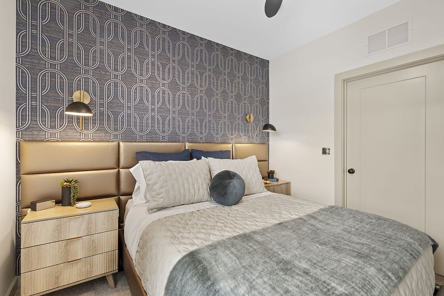 luxurious bedding and designer wallpaper complete the room to perfection