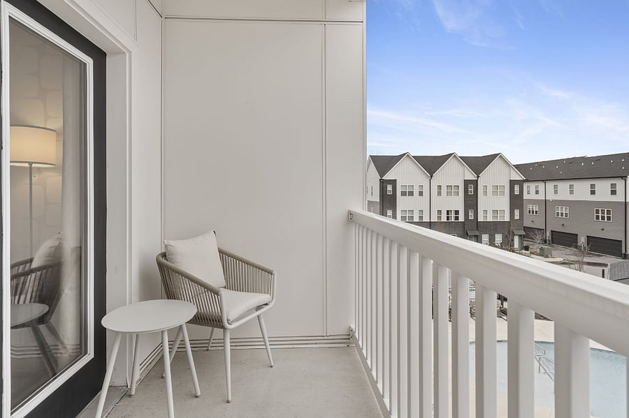 Spacious balcony overlooking the pool.